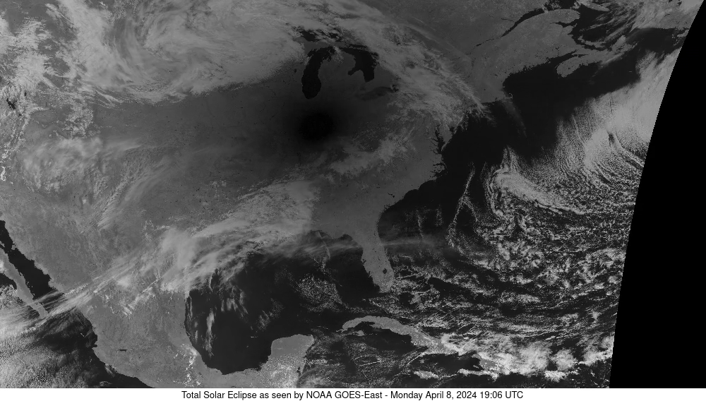 Unannotated GOES-East Band 3 frame labeled April 8, 2024, 19:06 UTC. A dark eclipse-shadow region lies over the central-eastern United States; this is the frame with the lowest sampled mean in the selected Indianapolis-area patch.